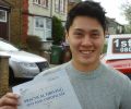 Anthony with Driving test pass certificate